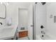 Modern bathroom features a white subway tile shower, black hardware, and single sink vanity at 1960 Sever Dr, Clearwater, FL 33764