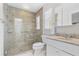 Tiled bathroom featuring a glass enclosed shower, tile flooring, with a single sink vanity at 1960 Sever Dr, Clearwater, FL 33764