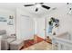 Bedroom showcasing a comfy chair, closet, wood floors and decor at 1960 Sever Dr, Clearwater, FL 33764