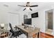 Office with ceiling fan, hardwood floors, a large desk, and view to another room at 1960 Sever Dr, Clearwater, FL 33764