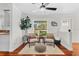 Cozy sitting area with neutral decor, hardwood floors, and plenty of natural light at 1960 Sever Dr, Clearwater, FL 33764