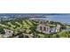 Scenic aerial view of a golf course community with waterfront condos and picturesque landscapes at 2015 Long Branch Ln, Clearwater, FL 33760