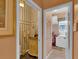 Charming powder room with decorative wallpaper and vanity at 2015 Long Branch Ln, Clearwater, FL 33760