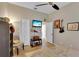 Well-lit bedroom with light walls and light tile flooring at 2015 Long Branch Ln, Clearwater, FL 33760