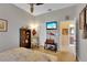 Bedroom with ceiling fan and a TV set up on the wall at 2015 Long Branch Ln, Clearwater, FL 33760