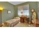 Bedroom with a desk, mirror, and a twin bed at 2015 Long Branch Ln, Clearwater, FL 33760