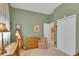 Bedroom with green painted walls, full length mirror, and a dresser at 2015 Long Branch Ln, Clearwater, FL 33760