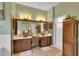 Elegant main bathroom with dual sinks, mosaic tile accents, and a separate shower, offering a luxurious spa-like retreat at 2015 Long Branch Ln, Clearwater, FL 33760