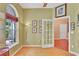 Cozy office space featuring large window and decorative tree branches on the wall at 2015 Long Branch Ln, Clearwater, FL 33760