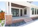 Inviting back porch with a brick foundation, stone pavers, and a stained wood ceiling with recessed lighting at 2101 3Rd N Ave, St Petersburg, FL 33713