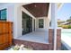 Inviting covered back porch with brick accents and tiled floor, perfect for outdoor relaxation at 2101 3Rd N Ave, St Petersburg, FL 33713