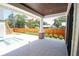 Covered patio with a stained wood ceiling, brick columns, and a view of the swimming pool and backyard at 2101 3Rd N Ave, St Petersburg, FL 33713