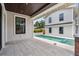Stylish back porch featuring tiled flooring, a wood ceiling, and a view of the refreshing swimming pool at 2101 3Rd N Ave, St Petersburg, FL 33713