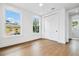 Bright bedroom features hardwood floors, closet, and windows with a view at 2101 3Rd N Ave, St Petersburg, FL 33713