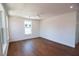Bright bedroom features hardwood floors and a large window with a view at 2101 3Rd N Ave, St Petersburg, FL 33713