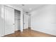 Large bedroom featuring a closet, wood-style flooring, and white walls at 2101 3Rd N Ave, St Petersburg, FL 33713