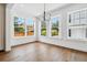 Sunlit dining room showcasing hardwood floors and multiple windows at 2101 3Rd N Ave, St Petersburg, FL 33713