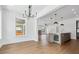 Open concept dining area features hardwood flooring and a view to the kitchen at 2101 3Rd N Ave, St Petersburg, FL 33713