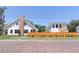 Charming white homes with a wooden fence and brick street at 2101 3Rd N Ave, St Petersburg, FL 33713