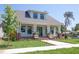 Charming home with front porch, well-maintained lawn, and mature trees at 2101 3Rd N Ave, St Petersburg, FL 33713