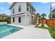 Exterior of home with a pool, a stairway to a private entry, and white siding at 2101 3Rd N Ave, St Petersburg, FL 33713