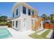Exterior of home with a pool, white siding, and stairway to a private entry at 2101 3Rd N Ave, St Petersburg, FL 33713