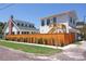 Charming two-story home with a fenced yard, showcasing its inviting facade and classic architecture at 2101 3Rd N Ave, St Petersburg, FL 33713