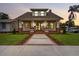 Craftsman style exterior showcases a large front yard and covered porch at 2101 3Rd N Ave, St Petersburg, FL 33713
