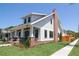 Charming two-story home featuring a welcoming front porch, brick accents, and lush green lawn at 2101 3Rd N Ave, St Petersburg, FL 33713