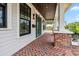 Charming front porch with brick flooring, wooden ceiling, and white support columns at 2101 3Rd N Ave, St Petersburg, FL 33713