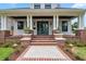 Inviting front porch with brick accents and stylish green doors at 2101 3Rd N Ave, St Petersburg, FL 33713