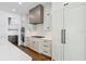Well-equipped kitchen with white cabinetry, subway tile backsplash, and stainless steel appliances at 2101 3Rd N Ave, St Petersburg, FL 33713