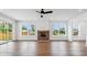 Bright living room with hardwood floors, fireplace, and natural light from large windows at 2101 3Rd N Ave, St Petersburg, FL 33713