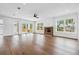 Spacious living room with hardwood floors and a brick fireplace at 2101 3Rd N Ave, St Petersburg, FL 33713