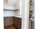 Pantry with cabinets, shelving, stone countertops, and stainless appliances nearby at 2101 3Rd N Ave, St Petersburg, FL 33713