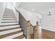 Elegant staircase featuring wood treads and black iron railings at 2101 3Rd N Ave, St Petersburg, FL 33713