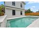 Private swimming pool with tiled accents, nestled between the house and a charming wooden fence at 2101 3Rd N Ave, St Petersburg, FL 33713