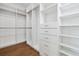 Spacious walk-in closet with custom shelving, drawers, and hanging rods, perfect for organization at 2101 3Rd N Ave, St Petersburg, FL 33713