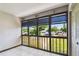 Enclosed balcony with tiled floors and window overlooking the neighborhood at 2131 Ridge S Rd # 3, Largo, FL 33778