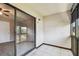 Enclosed outdoor balcony with sliding glass door access and white tile floors at 2131 Ridge S Rd # 3, Largo, FL 33778