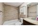 Full bathroom featuring combined shower and tub with vanity and custom cabinet at 2131 Ridge S Rd # 3, Largo, FL 33778