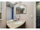 Bathroom vanity area featuring custom light fixture, sink, and large mirror at 2131 Ridge S Rd # 3, Largo, FL 33778