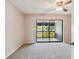 Bedroom with a ceiling fan, a sliding glass door to the screened-in porch, and neutral decor at 2131 Ridge S Rd # 3, Largo, FL 33778
