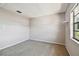 Bright bedroom with neutral walls, a window and shelving at 2131 Ridge S Rd # 3, Largo, FL 33778