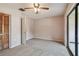 Bedroom featuring a ceiling fan, a closet, and access to a screened-in porch at 2131 Ridge S Rd # 3, Largo, FL 33778