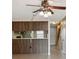 Open dining area featuring wood cabinets, neutral walls, and tile flooring at 2131 Ridge S Rd # 3, Largo, FL 33778