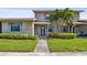 Cozy home with a well-manicured lawn, mature landscaping, and blue shutters enhancing the curb appeal at 2131 Ridge S Rd # 3, Largo, FL 33778