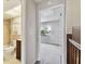 Hallway with bathroom and bedroom views, carpet flooring, and neutral paint at 2131 Ridge S Rd # 3, Largo, FL 33778