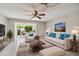 Bright living room featuring tile floors, comfortable seating, and sliding glass doors to the backyard at 2131 Ridge S Rd # 3, Largo, FL 33778
