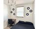 A simple bedroom featuring modern wall decor, a work desk and a chandelier at 2137 W Saint Louis St, Tampa, FL 33607